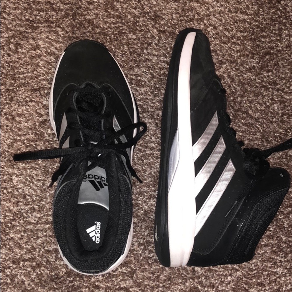 Adidas basketball shoes in black and white.